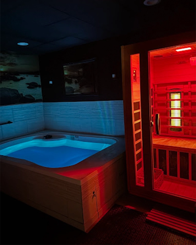 Cold Plunge Tank Next To Hot Infrared Sauna In Dark Room
